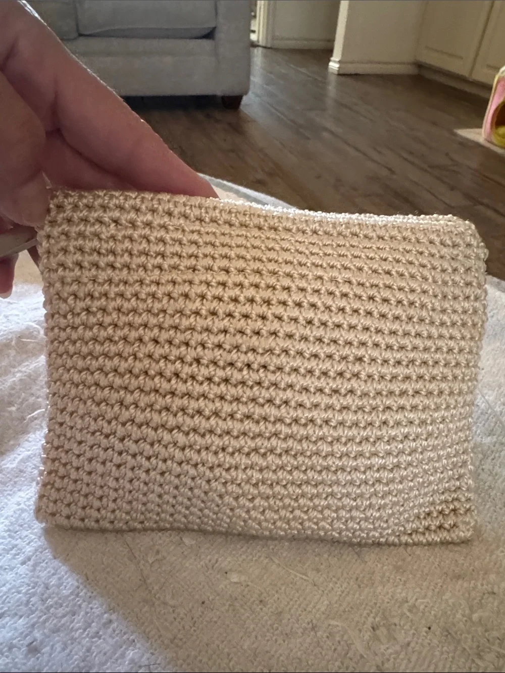 NWOT, The Sak crochet zip pouch in creme .
